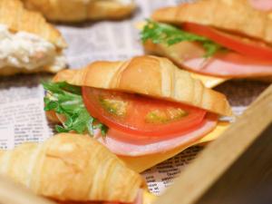 a group of sub sandwiches with tomatoes and lettuce at Dormy Inn Premium Shibuya-jingumae in Tokyo