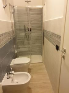 a bathroom with a shower and a toilet and a sink at Orizzonte House, Cilento Coast, Sapri in Sapri +12 photos