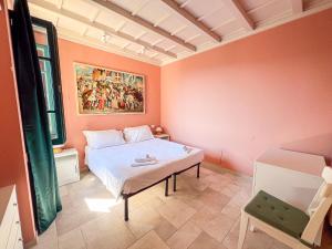 a bedroom with a bed and a painting on the wall at Montecatini Alto Art View in Nievole