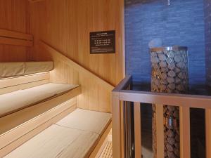 a small cabin with two bunk beds and a sign at Dormy Inn Premium Shibuya-jingumae in Tokyo