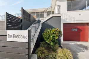 a building with a sign that reads the residence at Residence at 165 Great for large groups Sleeps 11 in Hobart