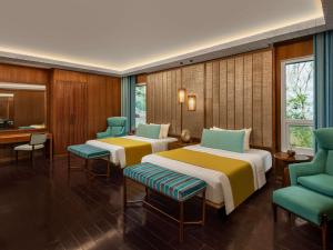Ein Bett oder Betten in einem Zimmer der Unterkunft Movenpick Resort & Spa Boracay