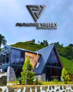 a building with a roof with the z z landscape valley sunovation at paradise valley bungalow in Ardeşen