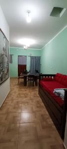 a room with a bed and a table in it at Apartamiento temporario Catamarca in San Fernando del Valle de Catamarca