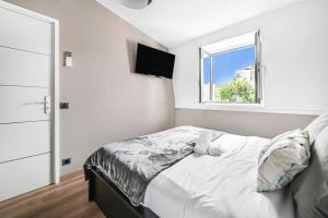 Postel nebo postele na pokoji v ubytování Le Finhley - 5p - Proche Disney & Paris