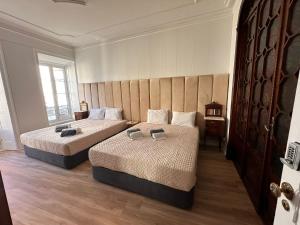 Postel nebo postele na pokoji v ubytování Azor International Hostel
