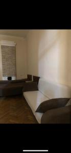 a room with a bed and a window in it at Sweet Home Agmashenebeli in Tbilisi City