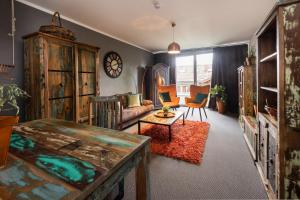 a living room with a couch and a table at Studio im Loft in Oberstdorf
