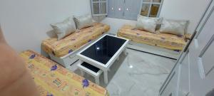 a hospital room with two beds and a tv at Maison de vacances vue sur la mer in Mazer