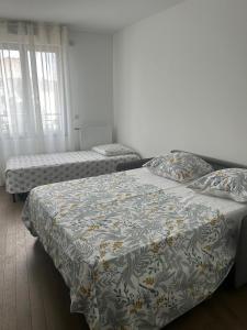 Postel nebo postele na pokoji v ubytování Charment F2 à 5 min de la Défense