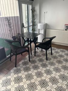 a dining room with a glass table and two chairs at Türkmen hotel in Istanbul +15 photos