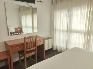 Łóżko lub łóżka w pokoju w obiekcie Hotel Hórreo by Bossh! Hotels