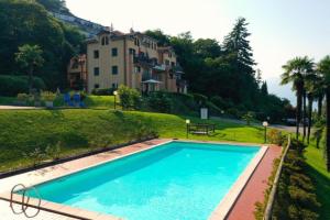 a large swimming pool in front of a building at Lago Bello in Stresa