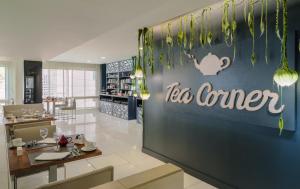 a restaurant with a tea corner sign on the wall at H10 Gran Tinerfe - Adults Only in Adeje