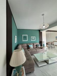 a living room with a couch and a table at Shalom 3 bedroom Maisonette in St Paul's Bay