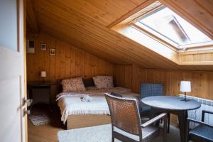 a bedroom with a bed in a room with a skylight at Doberek Noclegi w Beskidzie Niskim in Kobylanka