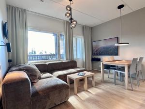Гостиная зона в RUKA CHALET 2402 - High quality SKI apartment