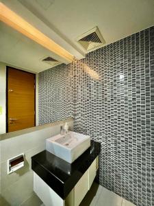 a bathroom with a sink and a mirror at Couple Suite at Casa Residency 5 mins walk to LRT, Jalan Alor & Bukit Bintang in Kuala Lumpur
