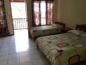 Letto o letti in una camera di Hotel Moctezuma
