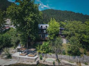 an aerial view of a building in the trees at Hotel Tazz - River Front Oasis Collection in Bihać