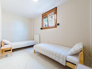 Posteľ alebo postele v izbe v ubytovaní Vacation house with a panoramic sea view and forest