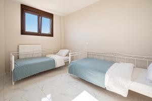 Posteľ alebo postele v izbe v ubytovaní Vacation house with a panoramic sea view and forest