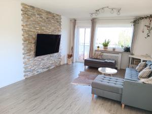 Μια τηλεόραση ή/και κέντρο ψυχαγωγίας στο Exklusive Wohnung mit Balkon