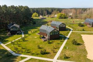 an aerial view of a house in a field at Luxury Seaside Home Papės Jūra in Pape
