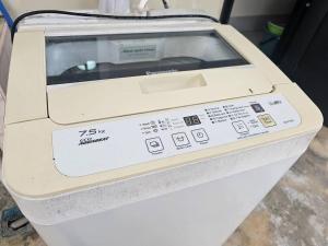 a fax machine sitting on top of a table at Lovely Kuching City Luxury Home in Kuching