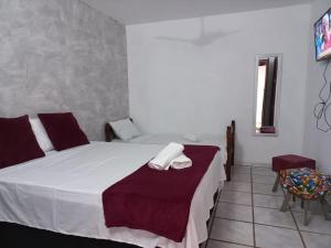 Postel nebo postele na pokoji v ubytování Villa dos Pássaros Paraty Hospedagem