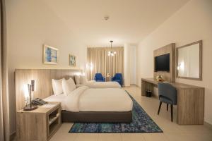 Postel nebo postele na pokoji v ubytování Golden Tulip Amman