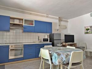 Kuchyň nebo kuchyňský kout v ubytování Apartment Luna