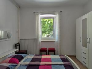 Postel nebo postele na pokoji v ubytování Apartment Luna