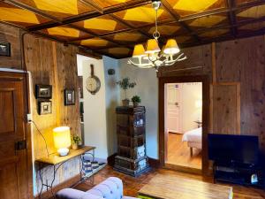 a living room with wood paneled walls and a ceiling at Gîte Maison des Vignerons in Riquewihr