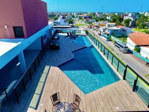 a balcony with a swimming pool on a building at Villas do Porto APTO 05 - Porto de Galinha in Porto De Galinhas