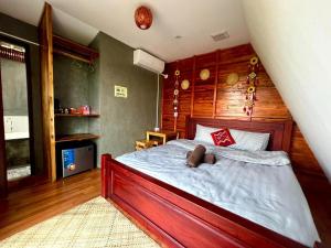 a bedroom with a bed with a teddy bear on it at Fuang Dao Mountain Resort in Muang Fuang