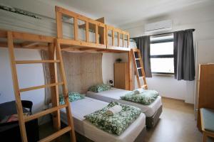 Cama ou camas em um quarto em WOT Lisbon Nomad