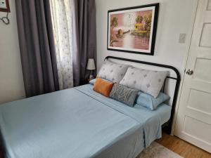 Postel nebo postele na pokoji v ubytování Quatro Marias Cozy Home + 17 fotografií