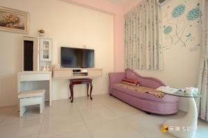 Televiisor ja/või meelelahutuskeskus majutusasutuses Hong Lai Guest House