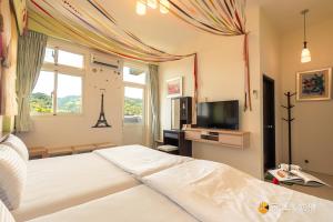 Televiisor ja/või meelelahutuskeskus majutusasutuses Hong Lai Guest House
