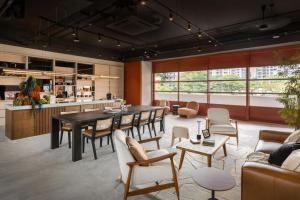 a living room with a table and chairs at Alma House in Singapore