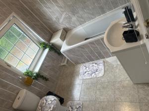 an overhead view of a bathroom with a sink at Signet Luxury 3-bedrooms, 2bathrooms House with WiFi & Netflix in Rochester +20 photos