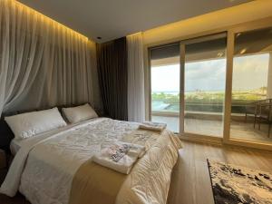 Ένα ή περισσότερα κρεβάτια σε δωμάτιο στο Hacienda bay