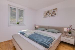 Ένα ή περισσότερα κρεβάτια σε δωμάτιο στο Apartment Lana