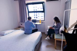 Cama ou camas em um quarto em WOT Lisbon Nomad