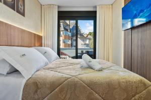 Ένα ή περισσότερα κρεβάτια σε δωμάτιο στο Leev Home 2 dorm 50m Rua Coberta by Achei Gramado