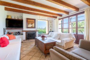 a living room with two couches and a fireplace at Son San Marti Gran in Can Picafort