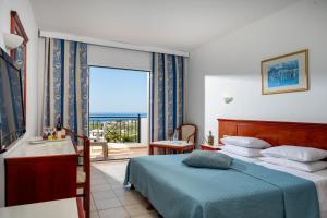 A bed or beds in a room at Mare Village