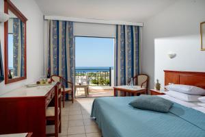 A bed or beds in a room at Mare Village