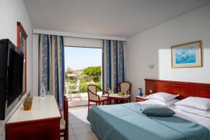A bed or beds in a room at Mare Village